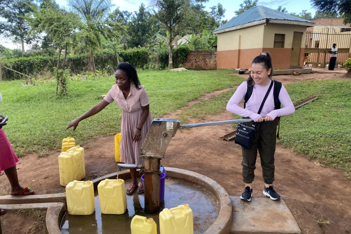 student at well with woman