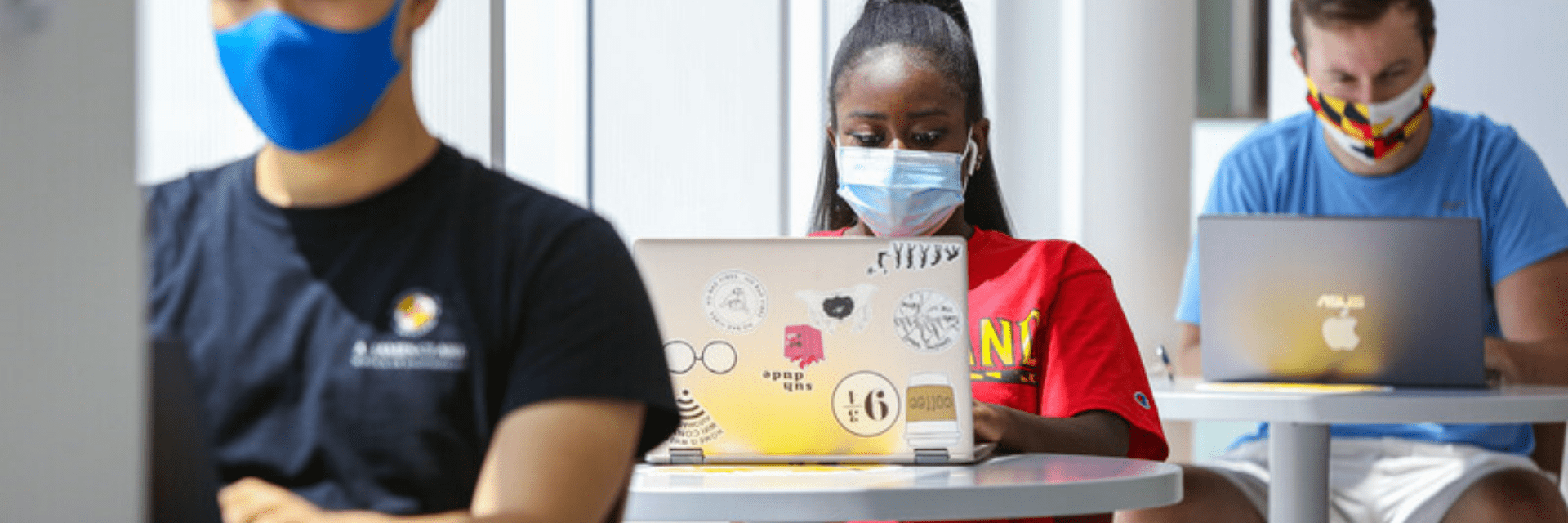 Students on their computers with masks