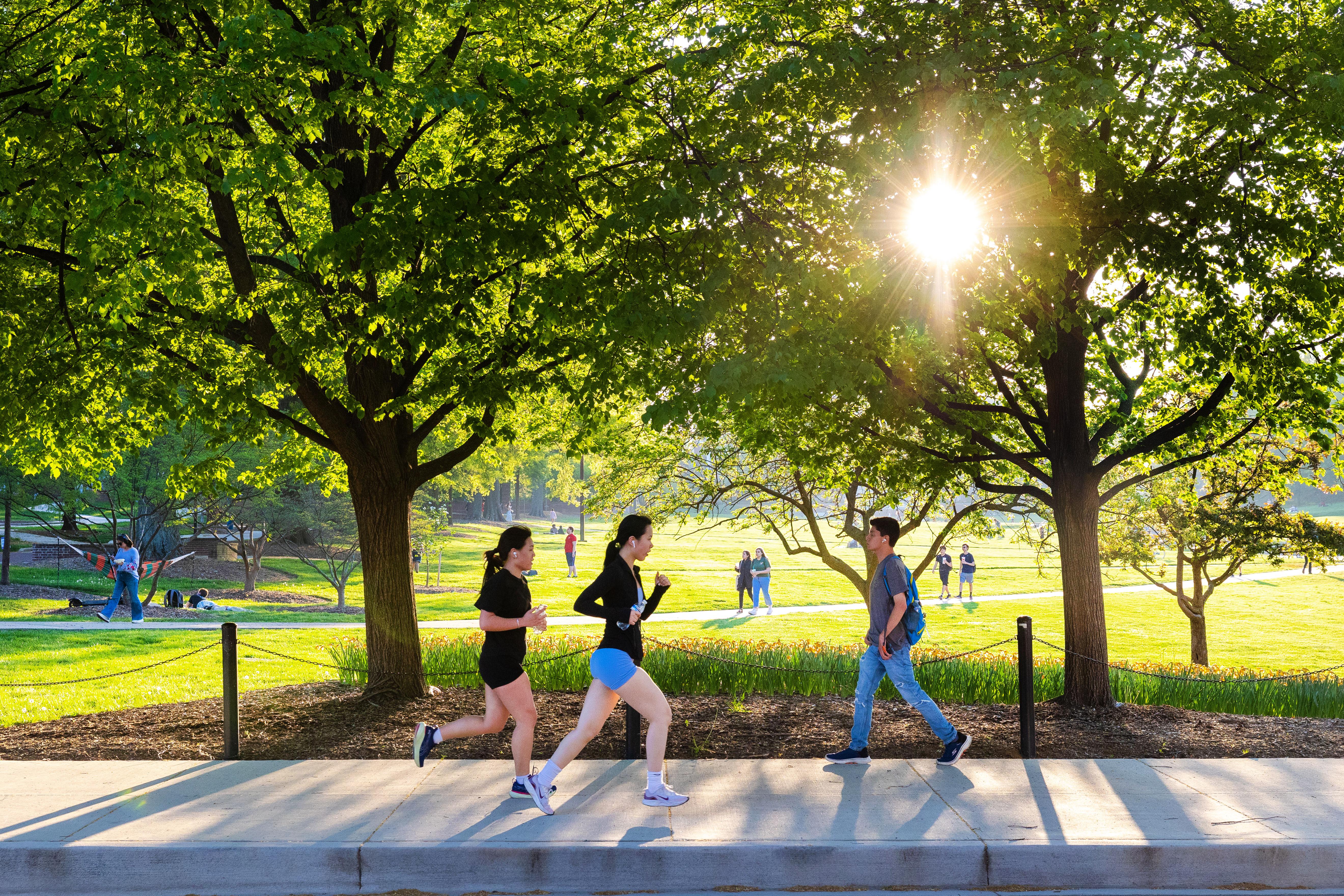 students jogging past mckeldin mall
