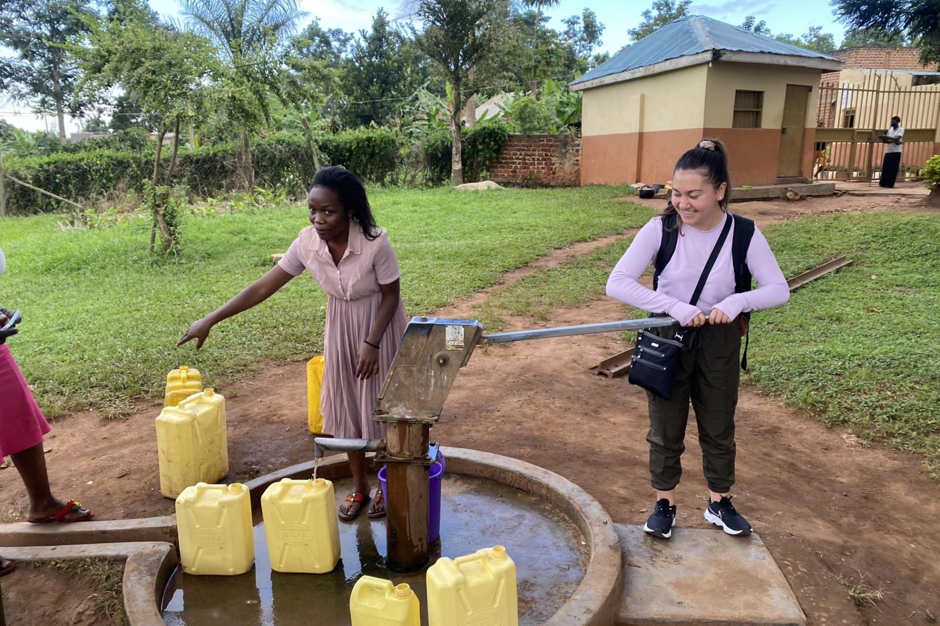 student at well with woman