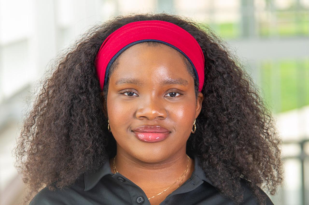 This is TA Aderinsola in a red headband