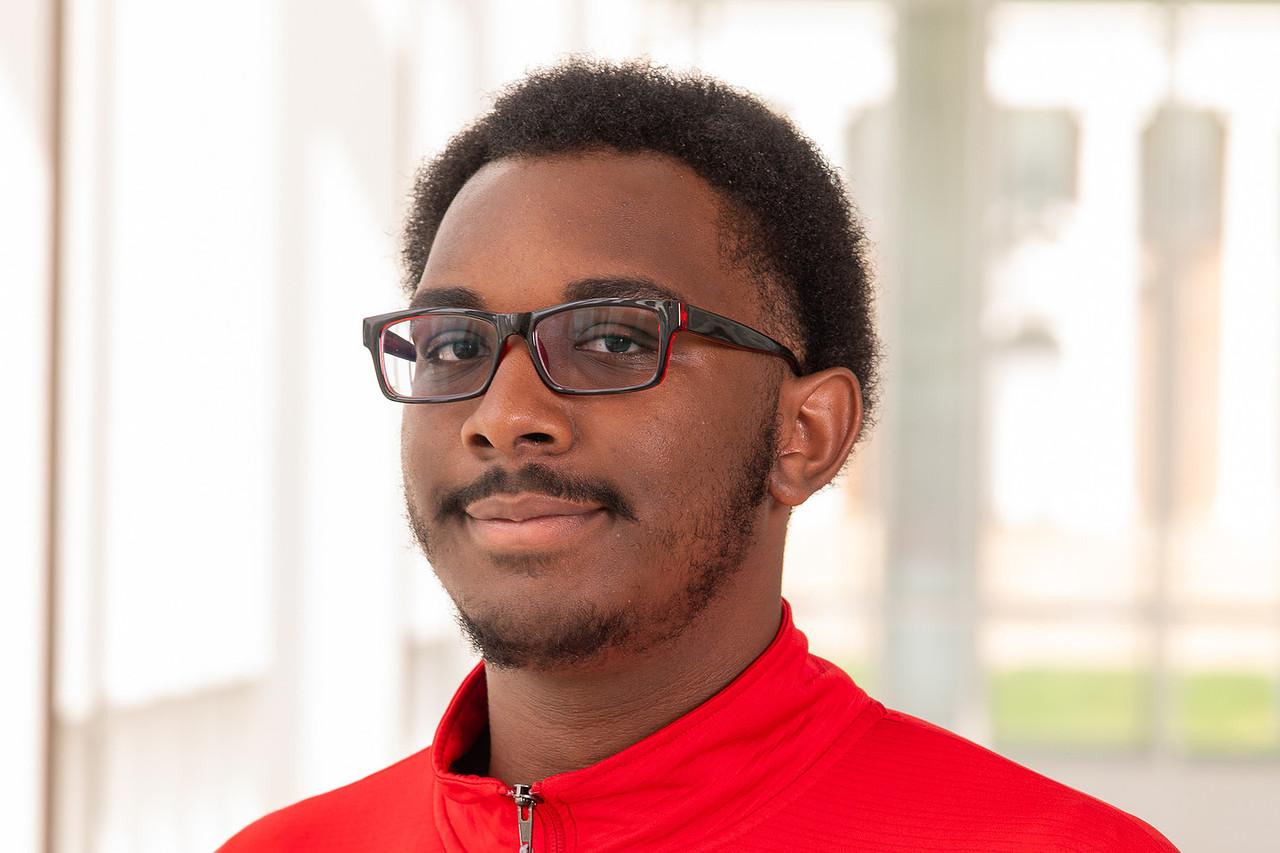 Transition Mentor Josh Battle in a red quarter zip