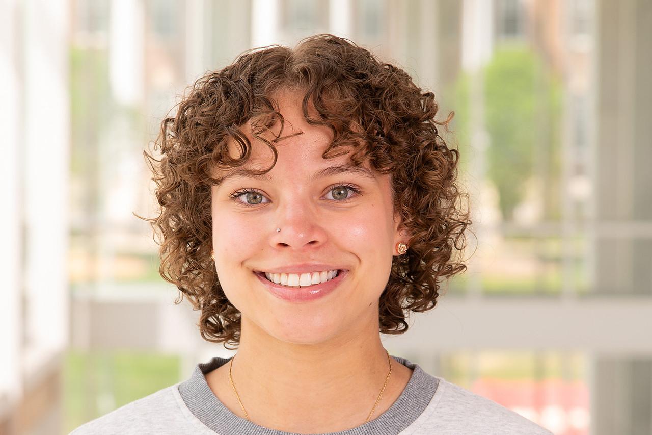 Transition Mentor Laila Carroll in a white t-shirt with a grey colored crew collar