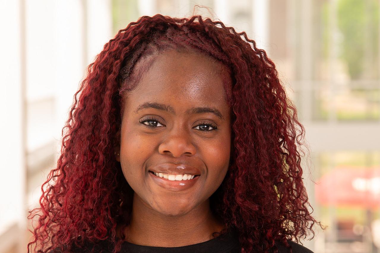Transition Mentor Muna Nkemakolam in a black UMD 