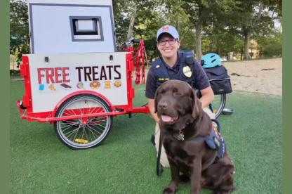 teddy the dog and police officer with free treat cart