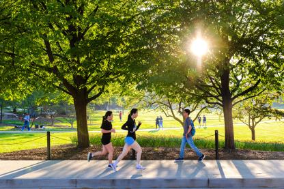 students jogging past mckeldin mall